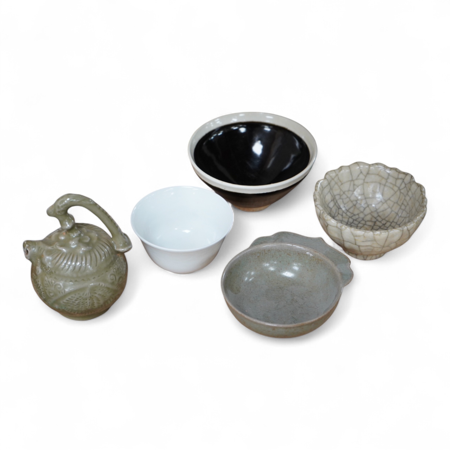 A collection of Chinese porcelain and pottery to include a naturalistic teapot, crackle glaze bowl and a ‘dragon’ bowl, largest 10cm in diameter